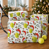 a set of Christmas-themed gift boxes with tennis-related designs, placed on a wooden surface. There are also two tennis balls and a tennis racket in the scene.
