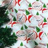a Christmas-themed wrapping paper with various Santa Claus and Christmas trees printed on it.