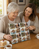 Two women are sitting at a table, smiling and looking at a collage of photos.