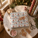a festive Christmas scene with a wrapped gift box, a potted plant, a star, candy canes, and holiday decorations such as a Christmas tree and ornaments.