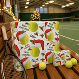 A tennis racket and tennis balls are placed next to a gift box with a Christmas-themed wrapping featuring tennis balls and a Santa hat.