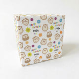 The image is a gift box with a pattern of cartoon hedgehog faces and flowers on it.