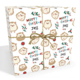 a square-shaped gift box with a white background and a pattern of cartoon hedgehog faces. The box is tied with a string and has the text "Merry Christmas Jess" written on it.