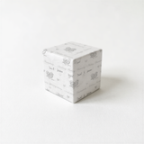 A white square-shaped object with a repeating pattern of the names 'David & Jessica' and the number '25' printed on it.
