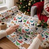 A person's hands are wrapping a gift with a patterned wrapping paper featuring colorful llamas and other animals.
