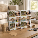 A gift box with a collage of photos, including images of people, is sitting on a wooden table next to a pair of scissors and a tag.