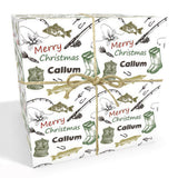 The image is a gift box with a Christmas theme, featuring illustrations of fishing and hunting equipment, such as fishing rods, bows, and arrows, along with the text "Merry Christmas Callum".