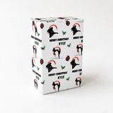 A white gift box with a repeating pattern of silhouettes of people performing martial arts moves, along with the text "Merry Christmas Kyle" printed on it.