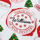 various Christmas-themed elements, including a Christmas tree, Santa Claus, and a red and white stamp with the text "North Pole William Air Mail Delivery".