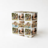 A gift box wrapped with a brown twine ribbon, featuring a collage of photos depicting people enjoying various activities, such as swimming, picnicking, and spending time together.