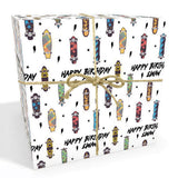 The image is a gift box with a white background and a repeating pattern of colorful skateboards. The text "Happy Birthday Ewan" is written on the box, indicating it is a birthday gift for someone named Ewan.