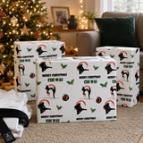 three wrapped Christmas gifts with martial arts-themed wrapping paper, placed on a carpeted floor in front of a Christmas tree.
