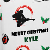 a graphic design with a silhouette of a person in a fighting stance, surrounded by holiday-themed elements such as holly berries and a holly leaf. The text "MERRY CHRISTMAS KYLE" is displayed below the silhouette, indicating a personalized Christmas greeting for someone named Kyle.