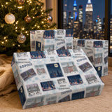 a Christmas tree with ornaments and a wrapped gift box with a pattern of cityscapes and snowflakes.