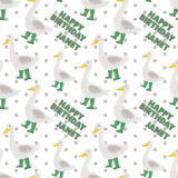 a repeating pattern of cartoon-style ducks wearing green rain boots and the text "Happy Birthday Janet" written on them.