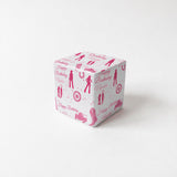 A white gift box with a pink and white birthday-themed design, featuring silhouettes of people and various birthday-related symbols.
