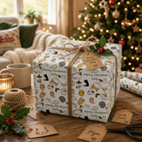 A festive Christmas scene with a wrapped gift box featuring a cat pattern, a Christmas tree, and holiday decorations.