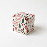 A white gift box with a festive Christmas-themed design, featuring various holiday symbols and text such as "Happy Christmas" and "Vancea".