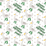 a repeating pattern of cartoon-style ducks wearing green rain boots and the text "Happy Birthday Janet" written on them.