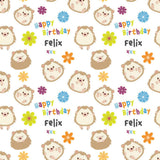 a repeating pattern of cartoon hedgehog faces, flowers, and birthday messages.