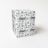 A white gift box with a pattern of soccer balls and the text "FOOTBALL FAN CAMERON" printed on it.