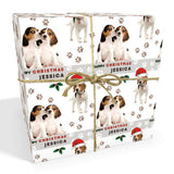 The image is a gift box wrapped with a Christmas-themed paper featuring images of two beagle dogs, one wearing a Santa hat.